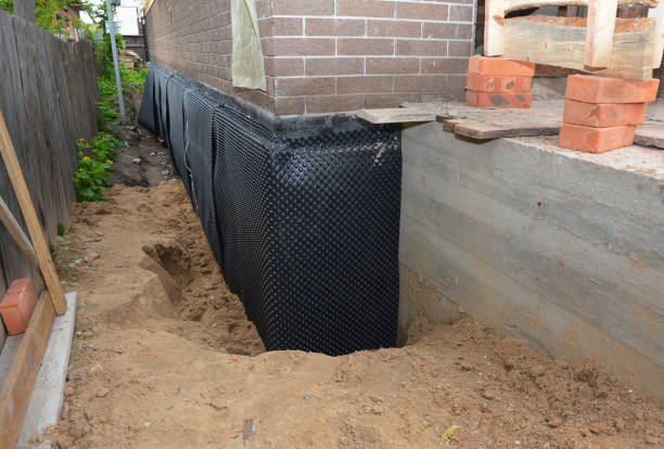 Happy homeowners after waterproofing job in Oshkosh